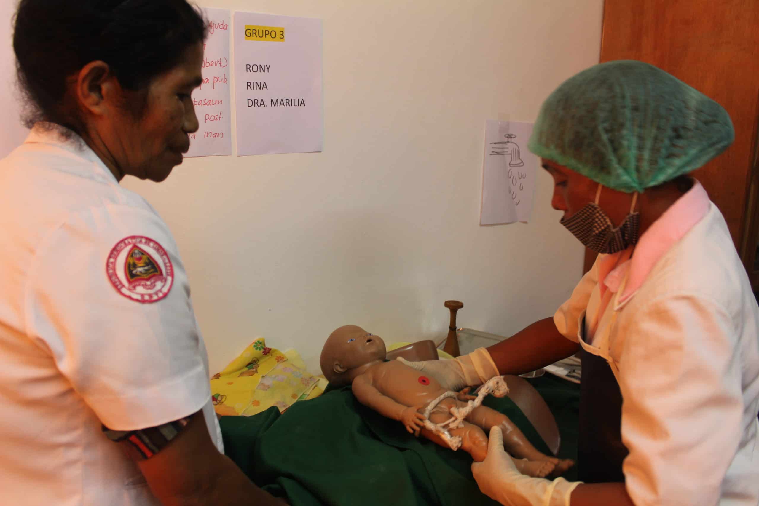 Midwife Catarina practices her emergency newborn care skills on a mannequin during the 26-day basic emergency obstetric and newborn care (BEmONC) training. 