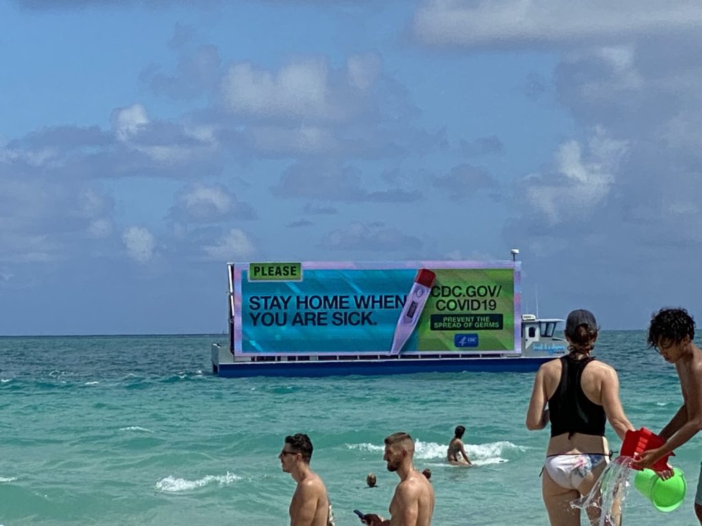 The CDC created floating billboards along the beaches of Miami to warn spring breakers about the spread of COVID-19.