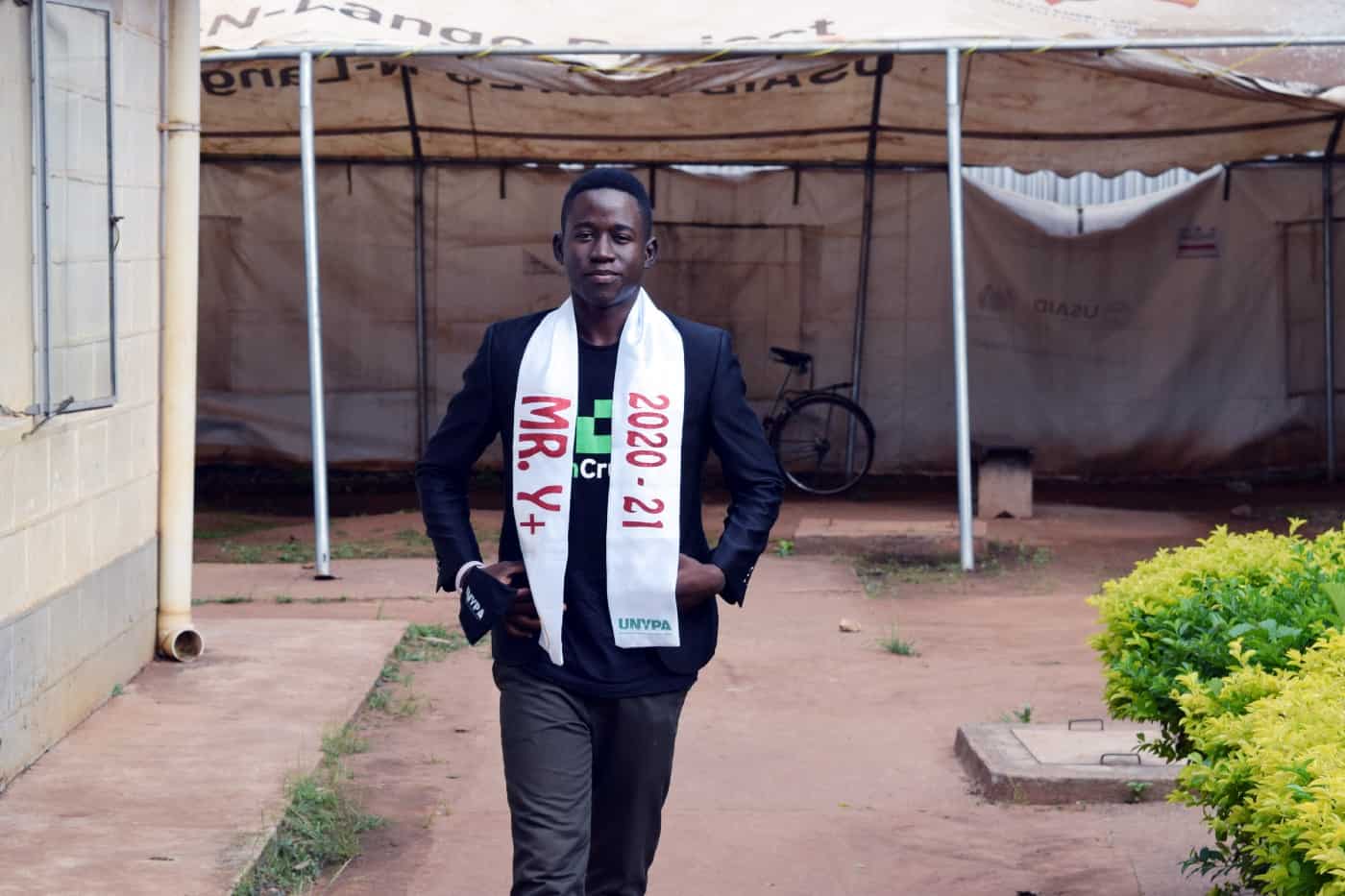 Oscar, in his winner’s sash, is ready to spread positive messages about being HIV-positive. / Angela Kateemu, USAID RHITES-North Lango Activity