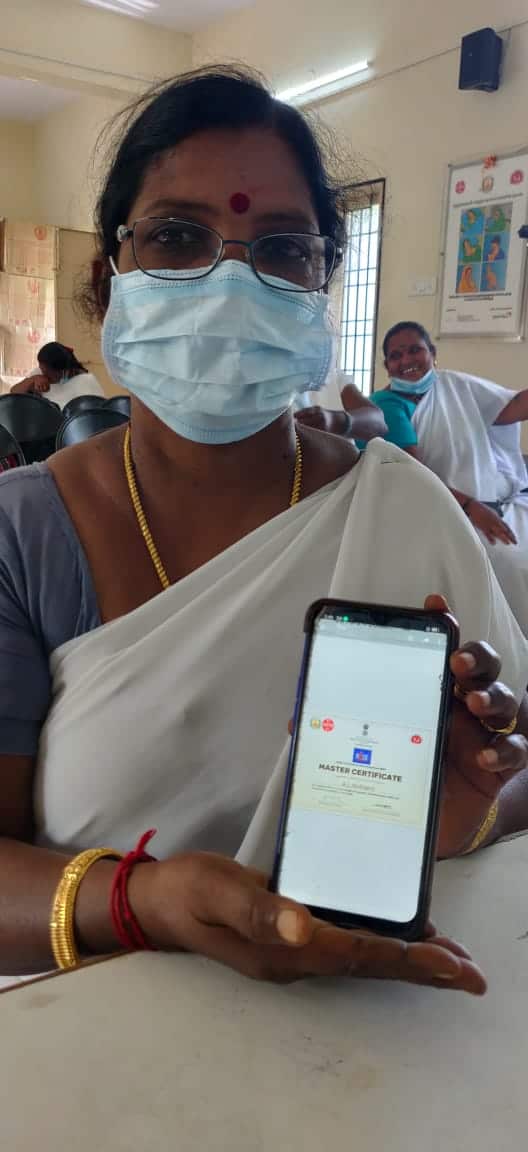 A health worker shows her digital certificate for completing a digital health capacity building training session.