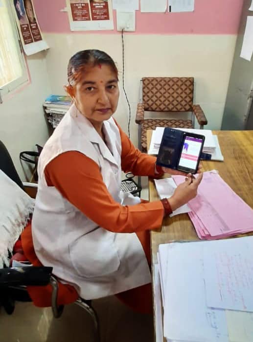 Mrs. Asha Devi from Shimla, Himachal Pradesh shows how she is using the RISE training tool on her smartphone.