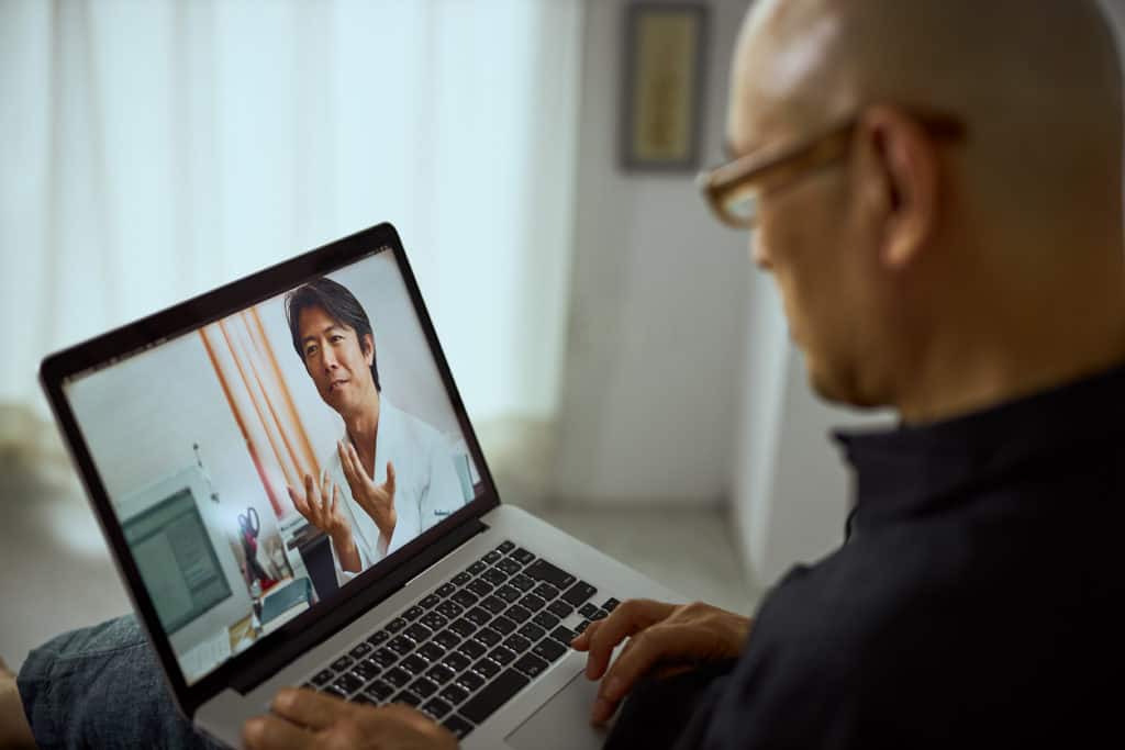 Cardiovascular doctor talking to patient via internet