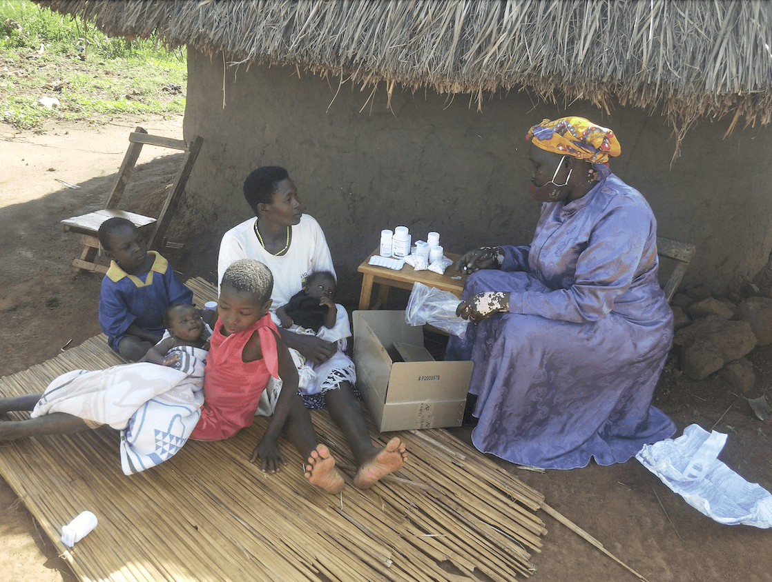 Jane provides services to Aida and her children. Photo: Lameck Kimuli