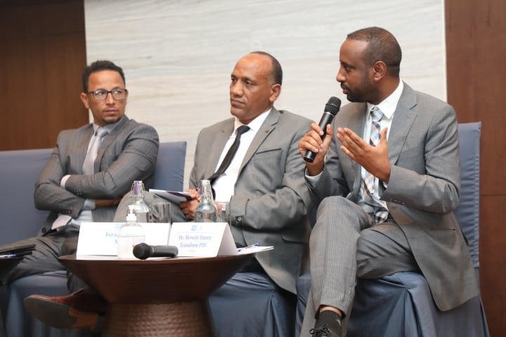 JSI Country Representative Binyam Desta (right) speaks on a panel at the L10K conference with L10K Project Director Dessalew Emaway and Israel Ataro from the Ministry of Health.