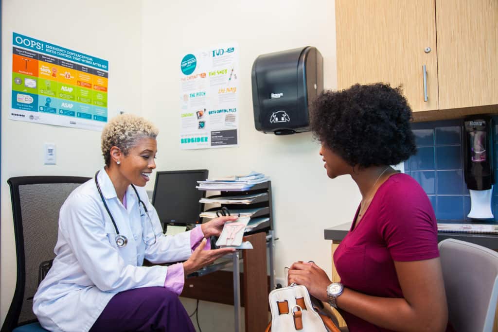 Family planning practitioner having a discussion with a patient.