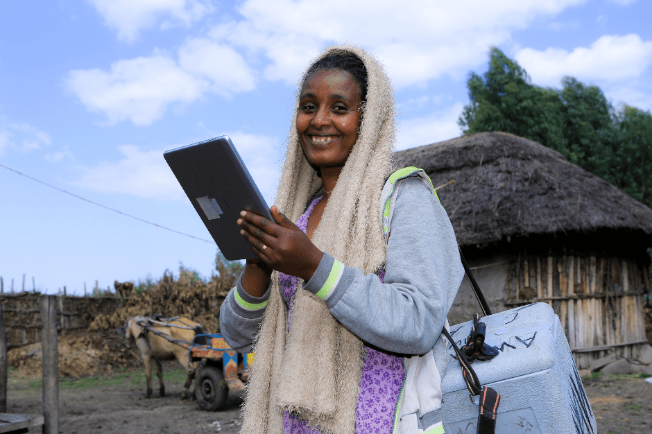 Gishu Beyene, a health extension worker in Arsi Zone, uses a DUP-provided tablet to capture information as she works.