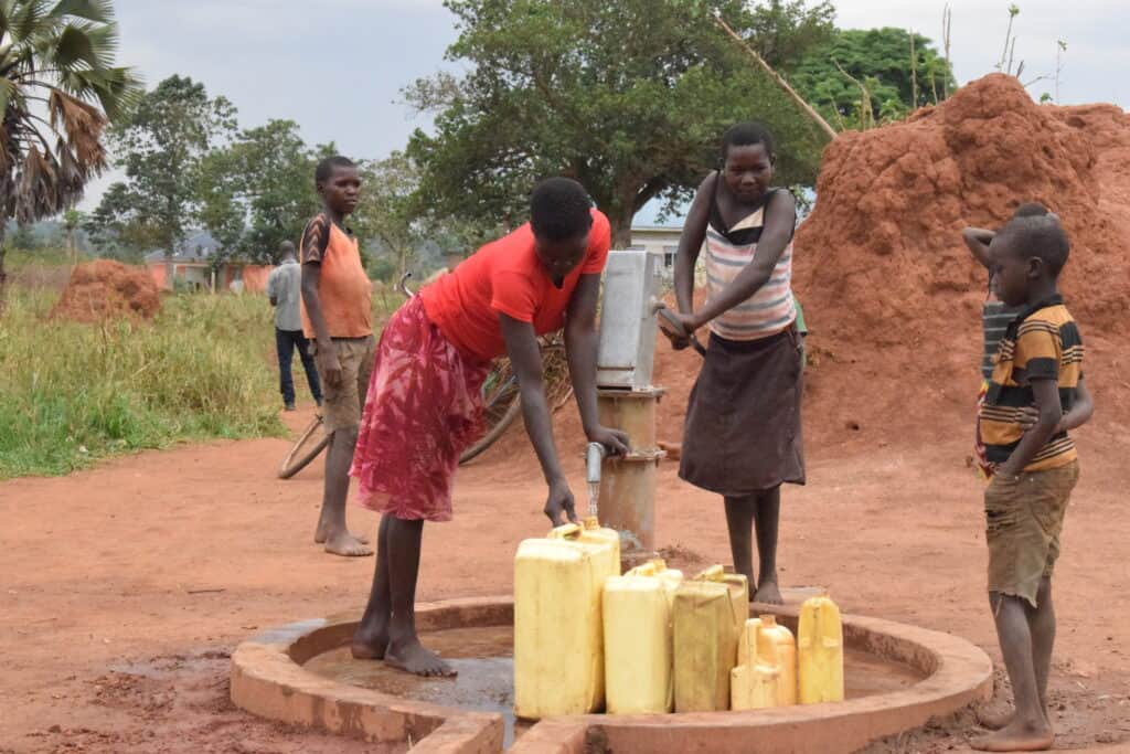 Residents fetch water at a RHITES-N, Lango project-constructed borehole