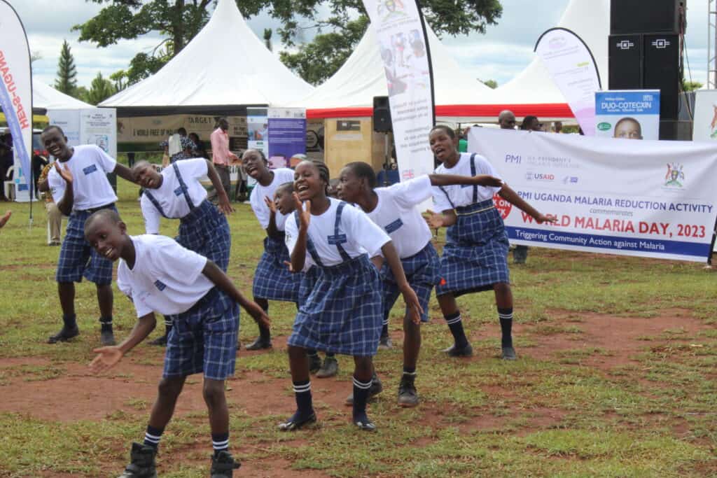 School girls in Uganda sing at an event