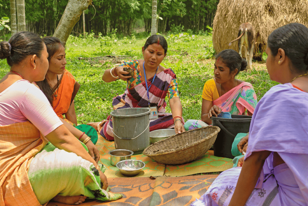 A Community Agriculture Care Service Provider demonstrates nutrition-sensitive horticulture practices to women in the Goalpara district of Assam State, India.