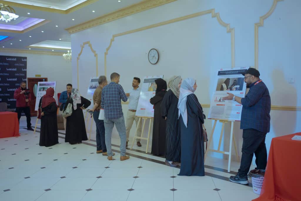 Project staff present their achievements to participants at an exhibition during the event. Photos by VFX Aden.