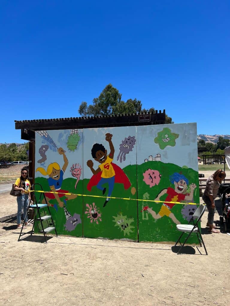 A finished mural depicting a superhero