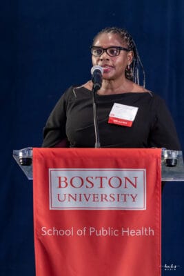 Muka Chikuba-McLeod speaks at the award ceremony in Atlanta, GA after receiving the BUSPH 2023 Distinguished Alumni Award.