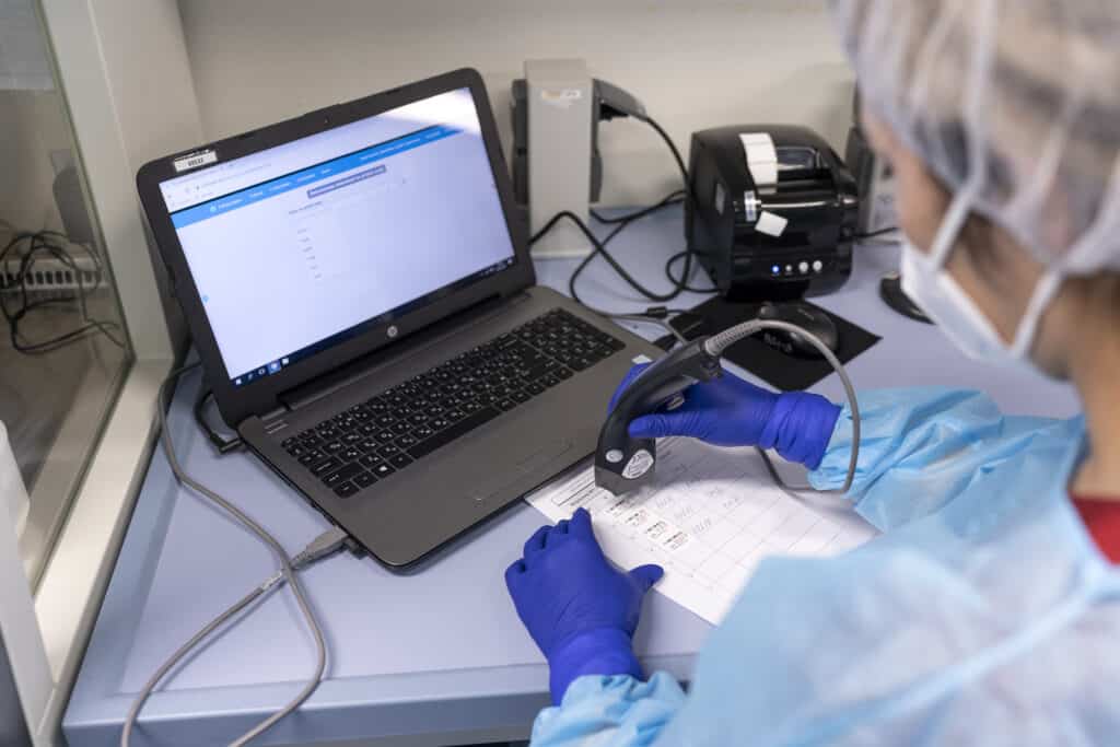 Nurzat, a lab technician, register the test samples for PCR testing in the National Reference Lab, in Bishkek, Kyrgyzstan, Wednesday, Feb. 24, 2021. (Yam G-Jun)